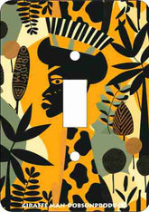 A decorative metal light switch wall plate with a giraffe and African-inspired print.